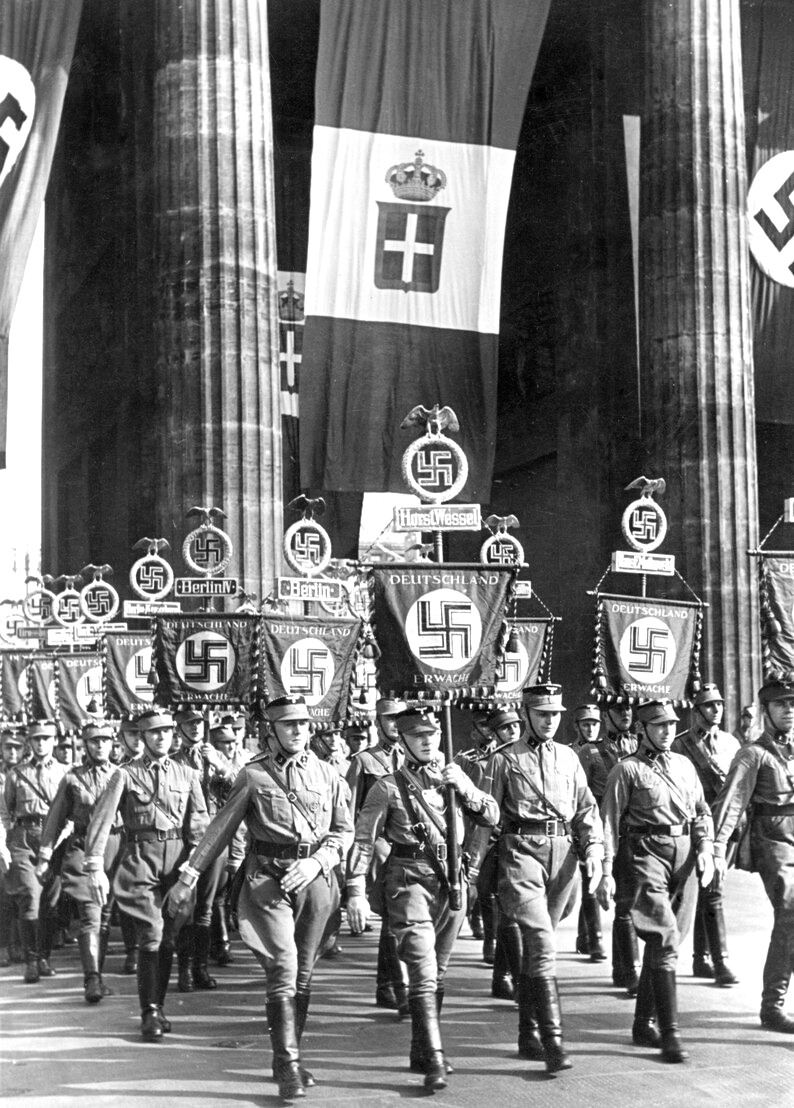 Swastika standard bearers of the German army marching for Deutschland